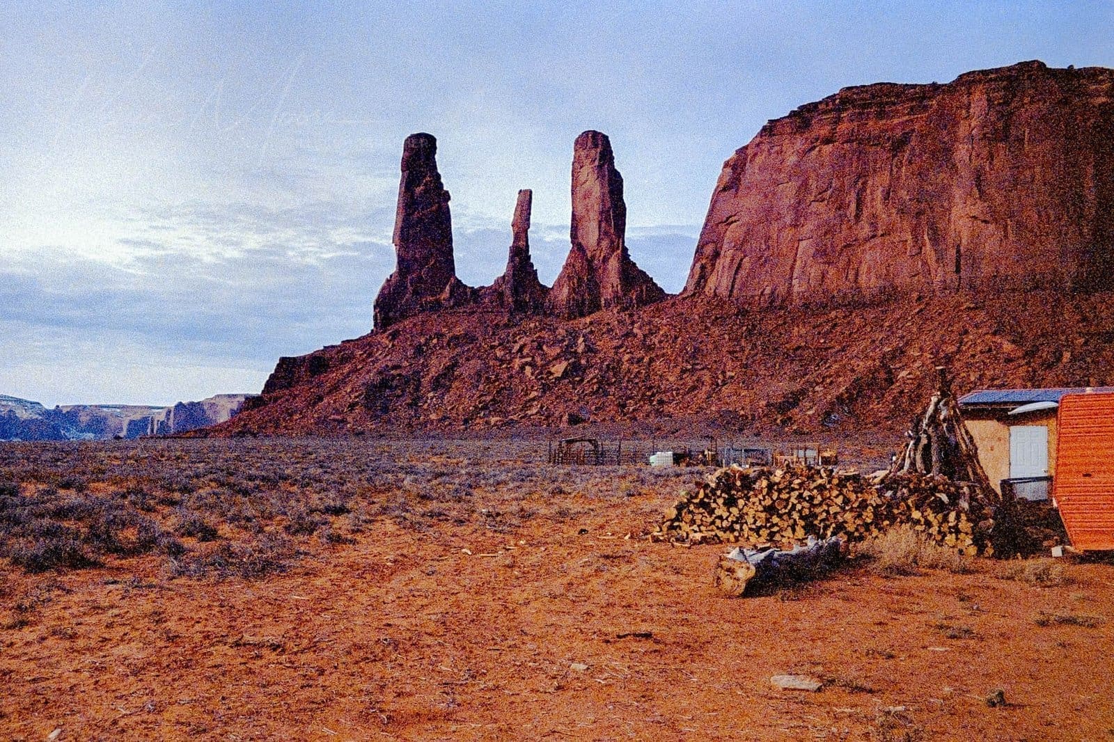 Twilight Tranquility: Southwest Desert Buttes and Homestead Desert landscape at dusk with buttes and small building in the American Southwest.